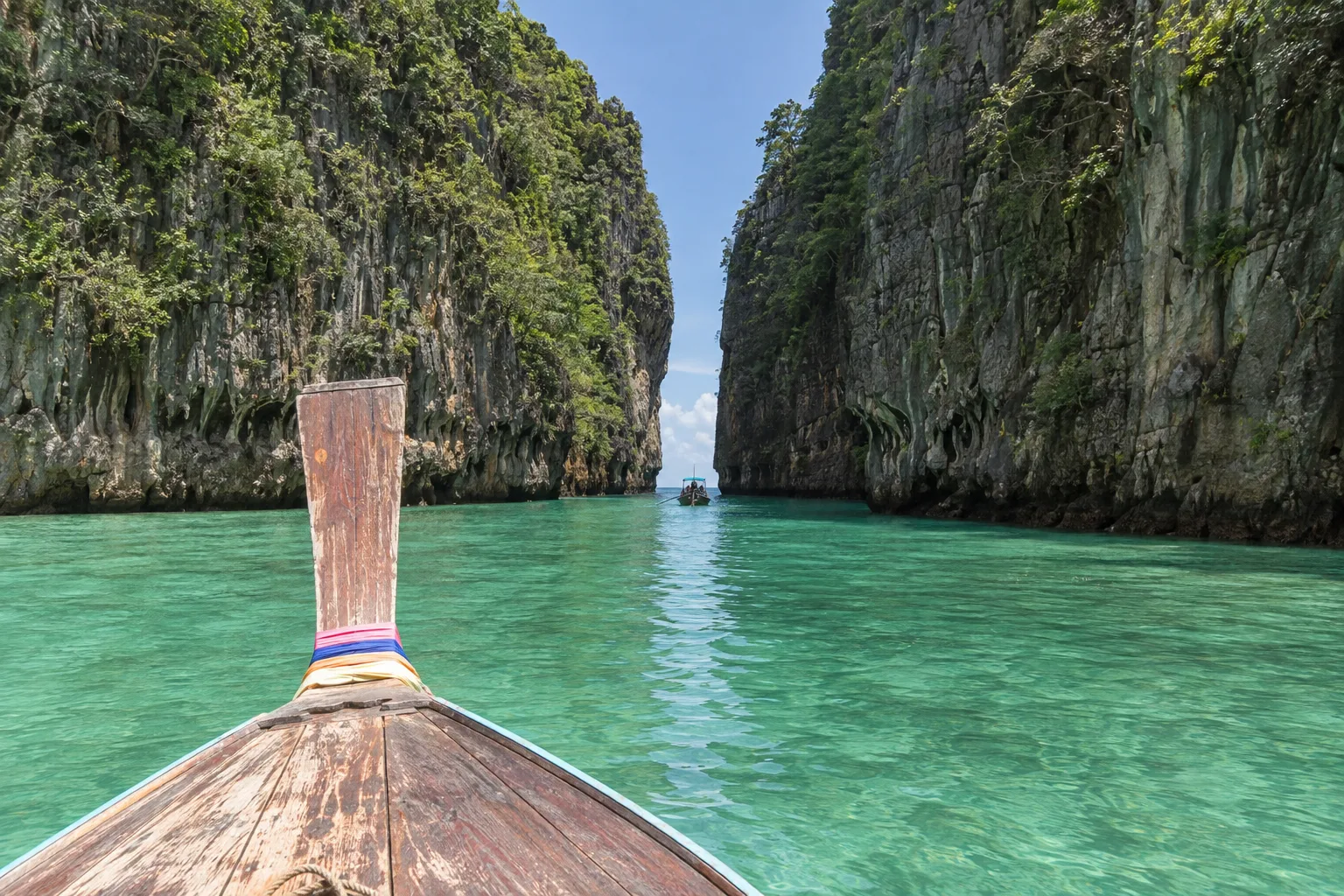 View from a Thai long-tail boat approaching the narrow entrance of Pileh Lagoon